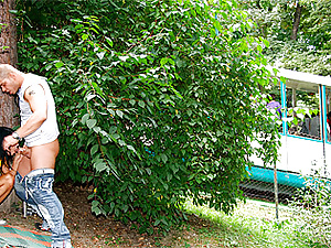 Hot teenager screwing boyfriend behind the tree in public