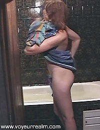 Spy on my horny wife taking a shower