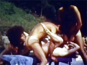 Two naughty seventies chicks sharing cock near the pool