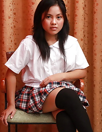 Cute Gelda strips from her school uniform to pleasure her pussy with a giant sex toy