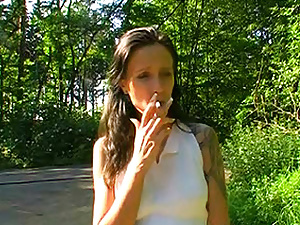 Sexy cigarette smoker getting naughty in the wilderness.