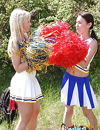 Two heady cheerleaders licking and toying their snatches outdoors