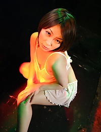Stripping Japanese teenager giving a blowjob in the club