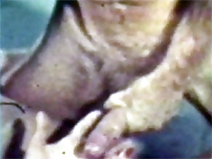 Retro chick sucking a stiff penis