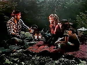 Two dirty seventies ladies stuffed by a campfire