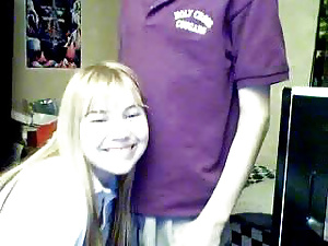 Smiling cute blonde teen girl sucks cock