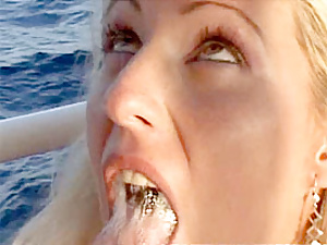 Blonde babe fucking two seniors on their big boat on the sea